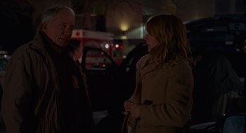 Movie still from “Certain Women” (2016), directed by Kelly Reichardt – A woman and a man standing next to each other on the street; Medium shot, Over the shoulder angle