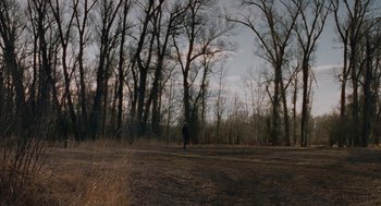 Movie still from “Certain Women” (2016), directed by Kelly Reichardt – A person standing in the middle of an empty field; Extreme Wide shot, High angle