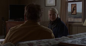 Movie still from “Certain Women” (2016), directed by Kelly Reichardt – Two people sitting at a table talking to each other; Medium shot, Over the shoulder angle