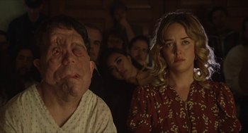 A group of people sitting in a room