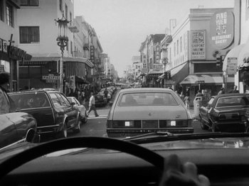 Movie still from “Chan Is Missing” (1982), directed by Wayne Wang – A black - and - white photo of a busy city street; Wide shot, High angle