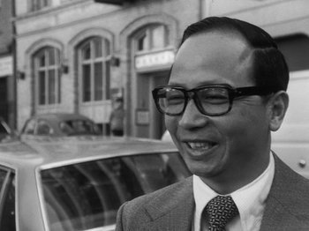 Movie still from “Chan Is Missing” (1982), directed by Wayne Wang – An older man wearing glasses and a suit; Close Up shot, Over the shoulder angle