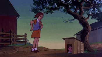 Movie still from “Charlotte's Web” (1973), directed by Iwao Takamoto – A girl standing next to a dog in a dog house; Wide shot, Low angle