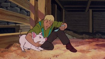 Movie still from “Charlotte's Web” (1973), directed by Iwao Takamoto – A man sitting on the ground next to a white pig; Medium shot, High angle