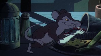 Movie still from “Charlotte's Web” (1973), directed by Iwao Takamoto – A mouse that is laying down in the dirt; Medium shot, High angle