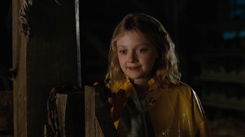 Movie still from “Charlotte's Web” (2006), directed by Gary Winick – A girl in a yellow raincoat holding a knife; Close Up shot, High angle