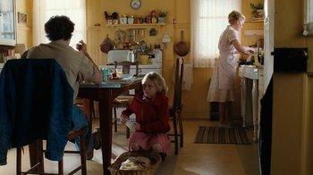 Movie still from “Charlotte's Web” (2006), directed by Gary Winick – A woman and two women in a kitchen eating food; Wide shot, Over the shoulder angle