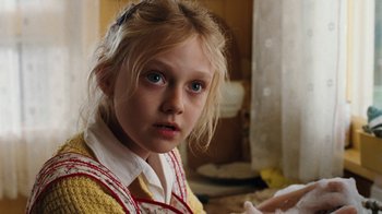 Movie still from “Charlotte's Web” (2006), directed by Gary Winick – A young girl with blue eyes is looking at the camera; Close Up shot, Over the shoulder angle