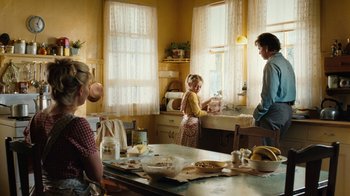 Movie still from “Charlotte's Web” (2006), directed by Gary Winick – A group of people standing in a kitchen preparing a meal; Medium shot, Over the shoulder angle