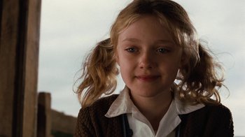 Movie still from “Charlotte's Web” (2006), directed by Gary Winick – A young girl wearing a white shirt and a brown sweater; Close Up shot, Low angle