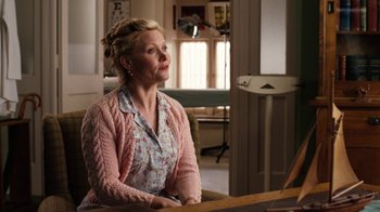 Movie still from “Charlotte's Web” (2006), directed by Gary Winick – A woman sitting at a table in front of a window; Medium shot, Over the shoulder angle