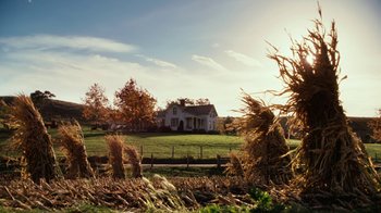 Movie still from “Charlotte's Web” (2006), directed by Gary Winick – A house sitting on top of a grass covered field; Extreme Wide shot, Low angle