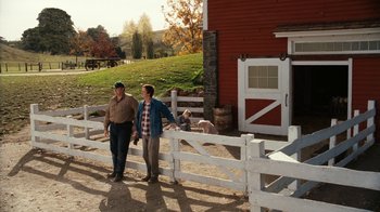 Movie still from “Charlotte's Web” (2006), directed by Gary Winick – Two men standing in front of a red barn; Wide shot, High angle