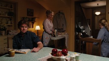Movie still from “Charlotte's Web” (2006), directed by Gary Winick – A man and a woman standing at a table with an ironing board; Medium shot, Over the shoulder angle
