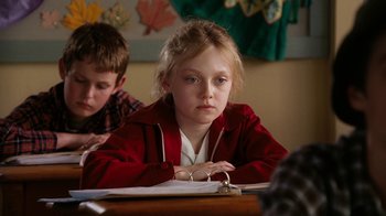 Movie still from “Charlotte's Web” (2006), directed by Gary Winick – A girl sitting at a table with a boy in front of her; Close Up shot, High angle