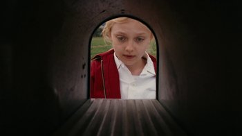 Movie still from “Charlotte's Web” (2006), directed by Gary Winick – A young girl looking through an opening in a mailbox; Close Up shot, Low angle