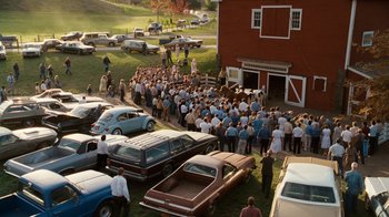 Movie still from “Charlotte's Web” (2006), directed by Gary Winick – A large group of people gathered in front of a barn; Extreme Wide shot, High angle