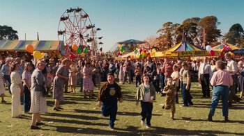 Movie still from “Charlotte's Web” (2006), directed by Gary Winick – A crowd of people at an amusement park; Extreme Wide shot, High angle