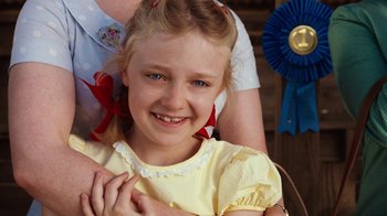 Movie still from “Charlotte's Web” (2006), directed by Gary Winick – A young girl smiling for the camera with her mother; Close Up shot, Over the shoulder angle