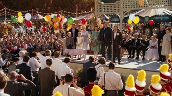 Movie still from “Charlotte's Web” (2006), directed by Gary Winick – A group of people standing on a stage in front of a crowd; Wide shot, High angle