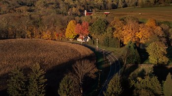Movie still from “Charlotte's Web” (2006), directed by Gary Winick – An aerial view of a rural area with a house and a barn; Extreme Wide shot, High angle