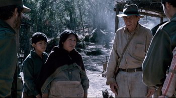 Movie still from “Che: Part Two” (2008), directed by Steven Soderbergh – An older man and two young people standing next to each other; Medium shot, Low angle