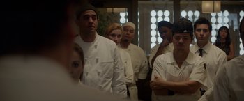 Movie still from “Chef” (2014), directed by Jon Favreau – A group of people standing in a room wearing chef's uniforms; Medium shot, Over the shoulder angle