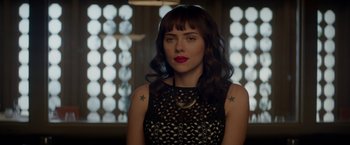 Movie still from “Chef” (2014), directed by Jon Favreau – A beautiful woman with long dark brown hair and red lipstick; Close Up shot, Over the shoulder angle