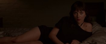 Movie still from “Chef” (2014), directed by Jon Favreau – A woman laying on the ground in a dark room; Medium shot, Overhead angle