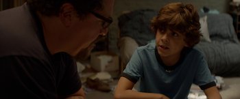Movie still from “Chef” (2014), directed by Jon Favreau – A man and a boy are talking to each other; Close Up shot, Over the shoulder angle