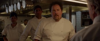 Movie still from “Chef” (2014), directed by Jon Favreau – Two men in white chef's uniforms standing in a kitchen; Close Up shot, Low angle