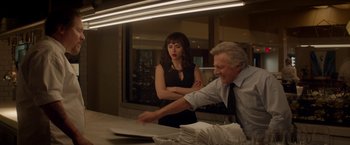 Movie still from “Chef” (2014), directed by Jon Favreau – A man and a woman in front of a counter; Medium shot, Over the shoulder angle