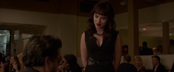 Movie still from “Chef” (2014), directed by Jon Favreau – A woman in a black dress standing in front of a man; Medium shot, Over the shoulder angle