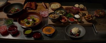 Movie still from “Chef” (2014), directed by Jon Favreau – A bunch of different foods are on a table; Wide shot, Overhead angle