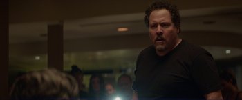 Movie still from “Chef” (2014), directed by Jon Favreau – A man standing in front of a group of people; Close Up shot, Over the shoulder angle