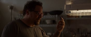 Movie still from “Chef” (2014), directed by Jon Favreau – A man looking at his cell phone in the dark; Close Up shot, Low angle