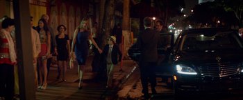 Movie still from “Chef” (2014), directed by Jon Favreau – A woman and a boy walking down a street; Wide shot, Over the shoulder angle