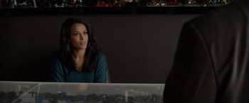 Movie still from “Chef” (2014), directed by Jon Favreau – A woman sitting in front of a mirror in a room; Close Up shot, Over the shoulder angle