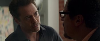 Movie still from “Chef” (2014), directed by Jon Favreau – A man in a black shirt is talking to another man in glasses; Close Up shot, Over the shoulder angle