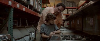 Movie still from “Chef” (2014), directed by Jon Favreau – A man and a boy looking at a computer screen; Close Up shot, Over the shoulder angle