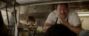 Movie still from “Chef” (2014), directed by Jon Favreau – A man and a child in a kitchen preparing a meal; Close Up shot, Over the shoulder angle