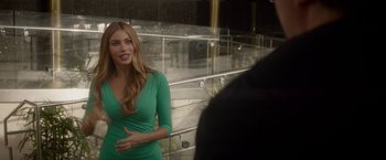 Movie still from “Chef” (2014), directed by Jon Favreau – A woman in a green dress talking to a man; Medium shot, Over the shoulder angle