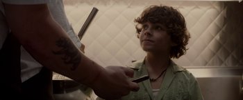 Movie still from “Chef” (2014), directed by Jon Favreau – A person holding a pair of scissors in their hand; Close Up shot, Over the shoulder angle