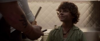 Movie still from “Chef” (2014), directed by Jon Favreau – A young boy is getting his teeth examined by a dentist; Close Up shot, Over the shoulder angle