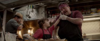 Movie still from “Chef” (2014), directed by Jon Favreau – A man and a boy in a kitchen; Close Up shot, Over the shoulder angle