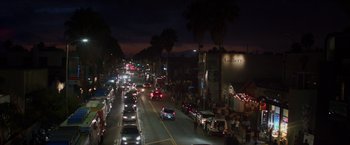 Movie still from “Chef” (2014), directed by Jon Favreau – A street filled with lots of traffic at night time; Extreme Wide shot, High angle