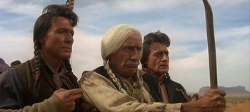 Movie still from “Cheyenne Autumn” (1964), directed by John Ford – A group of men standing next to each other; Medium shot, Low angle