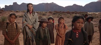 Movie still from “Cheyenne Autumn” (1964), directed by John Ford – A group of people standing next to each other in the desert; Medium shot, Low angle
