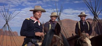 Movie still from “Cheyenne Autumn” (1964), directed by John Ford – Two men on horseback in a desert area; Medium shot, Low angle
