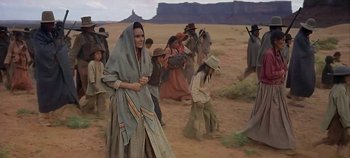 Movie still from “Cheyenne Autumn” (1964), directed by John Ford – A group of people walking through the desert; Wide shot, Low angle